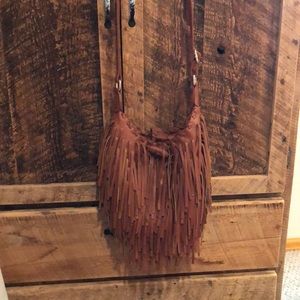 Crossbody leather fringe ladies purse.